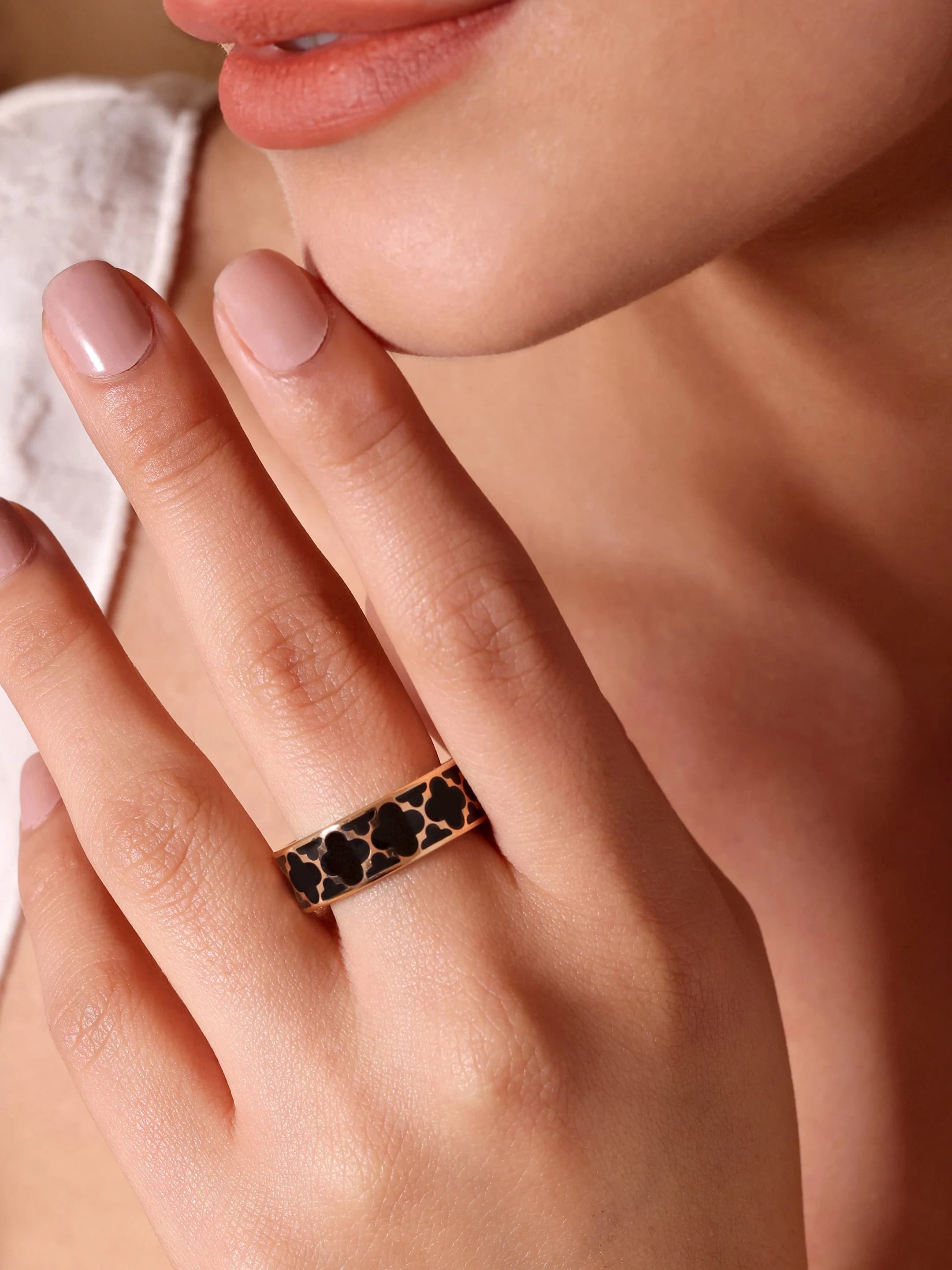 Model wearing fine jewelry — studio angle